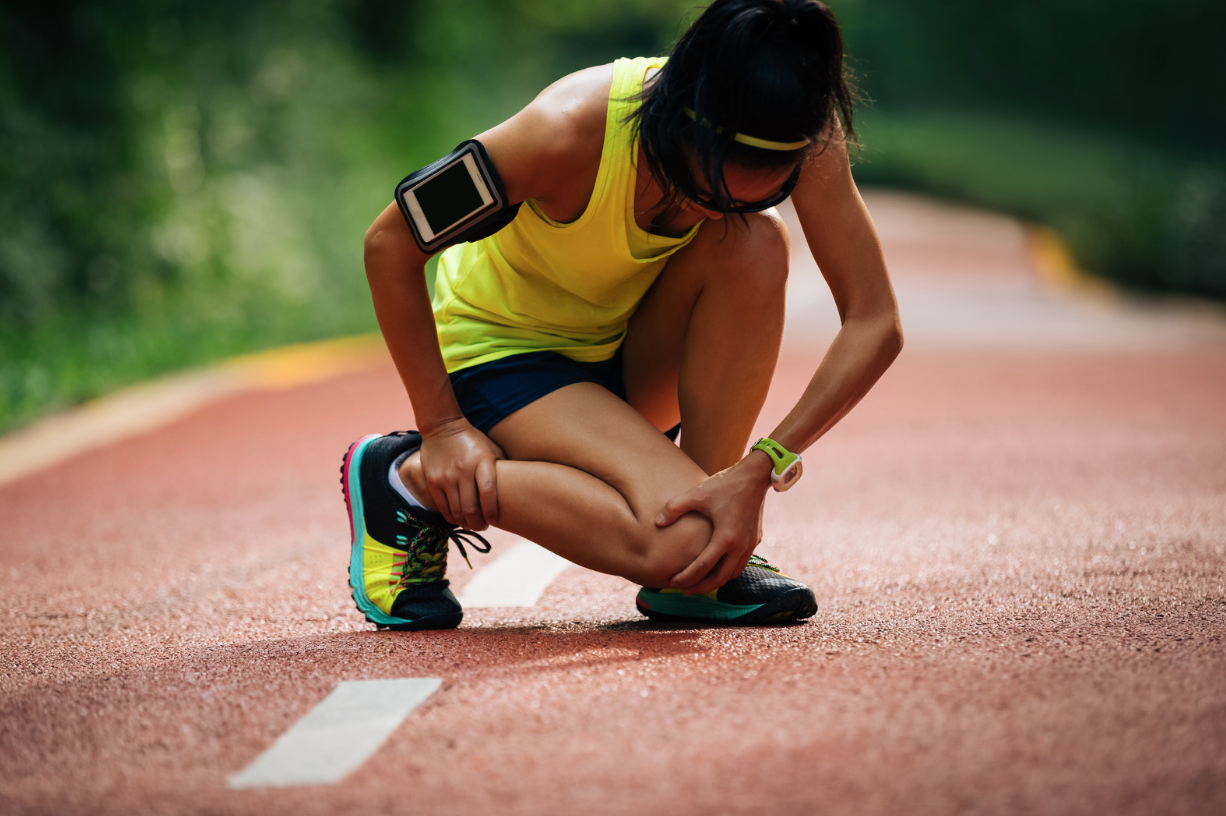 Runner managing a knee and ankle injury while training